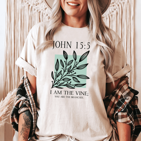 a woman wearing a t - shirt that says john 15 5 i am the vine