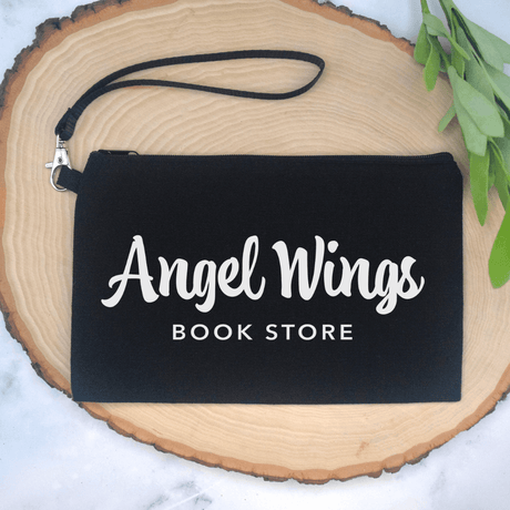 Angel Wings Bookstore Wristlet Cosmetic Bag Cosmetic Bag Color: Black $10.75 Winks Design Studio,LLC